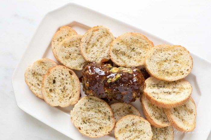 chevre cheese covered in pistachios and fig jam