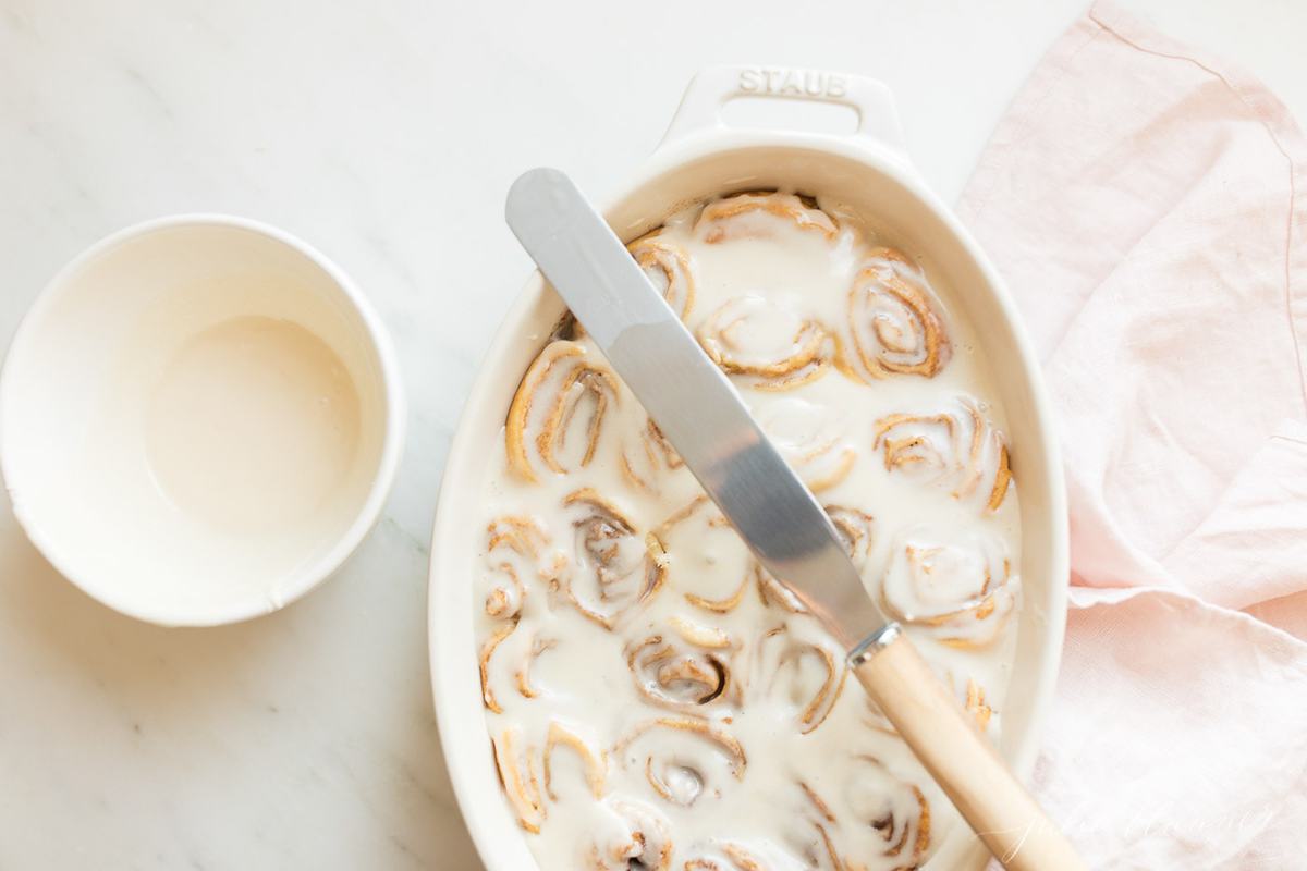 cinnamon roll glaze on cinnamon rolls