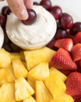 cream cheese fruit dip on a platter of fruit