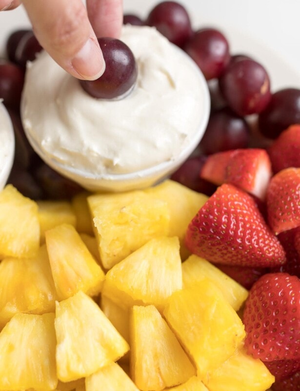 cream cheese fruit dip on a platter of fruit