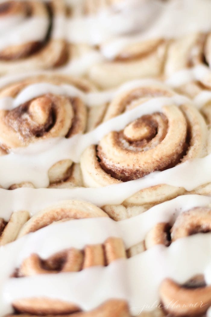 cinnamon rolls covered in cream cheese icing