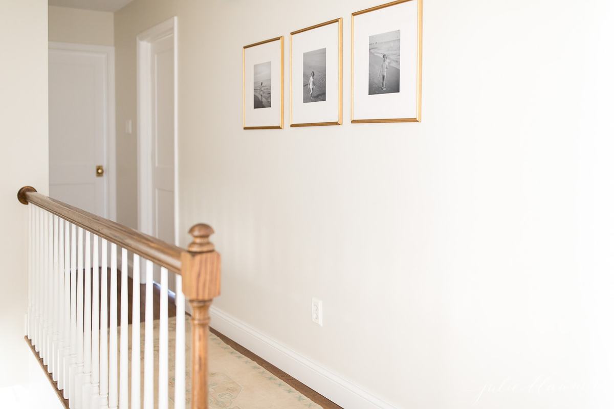 upstairs hallway in a vintage home, wood floors and white paint
