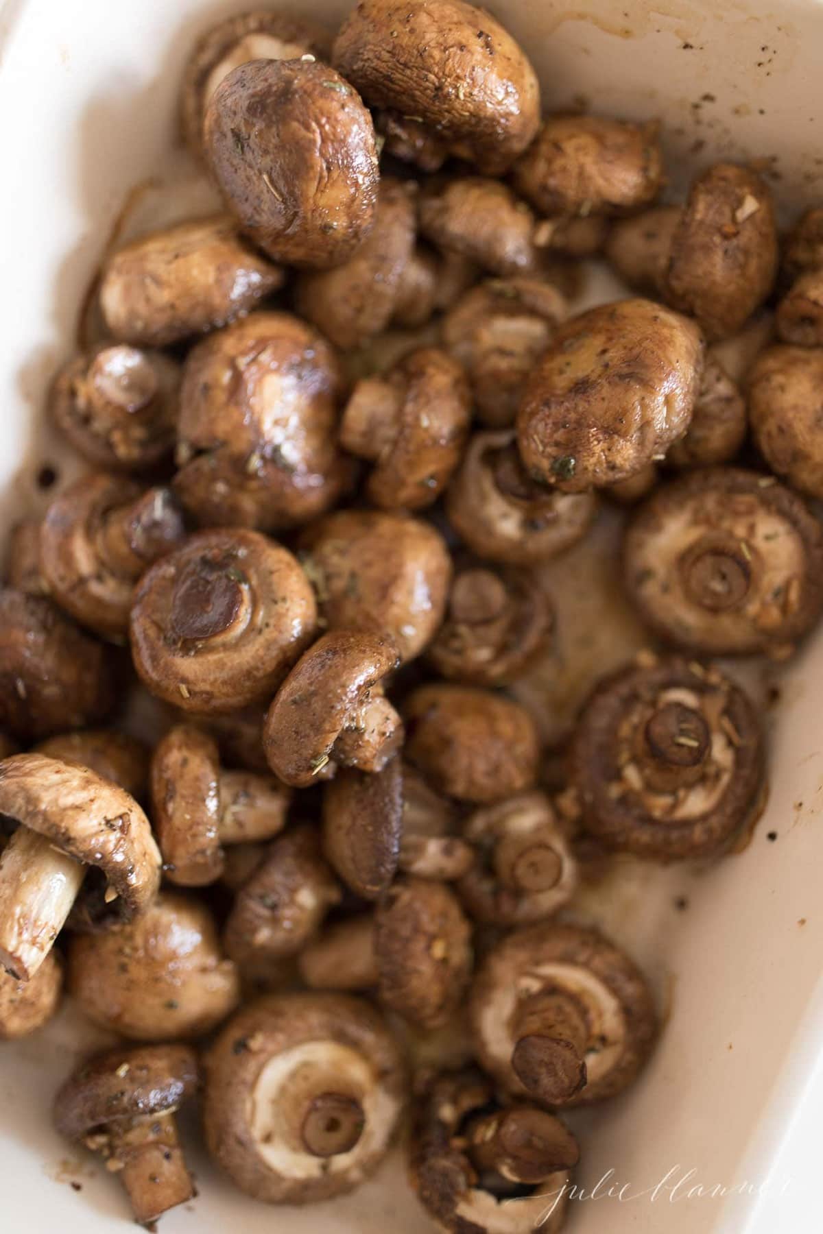 roasted mushrooms in a white baking dish