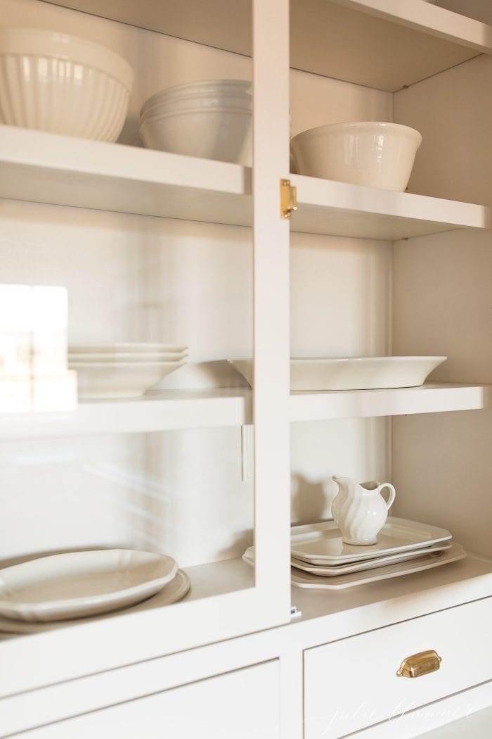 cabinet with platters and mixing bowls