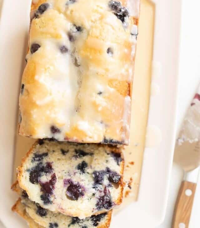 blueberry bread sliced with a knife