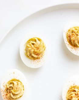 avocado deviled eggs on a serving platter