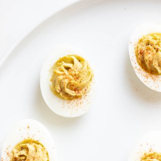 avocado deviled eggs on a serving platter