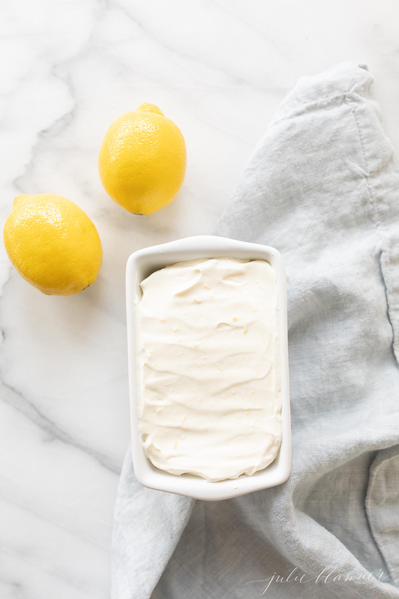 homemade lemon ice cream in a white loaf pan