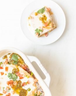 slice of mexican breakfast casserole on a plate next to casserole dish