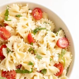 bow tie pasta salad in white serving bowl
