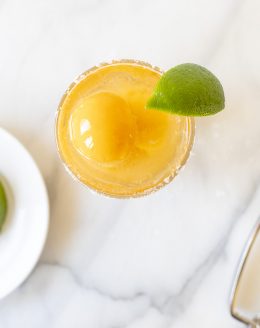 mango margarita float in a glass