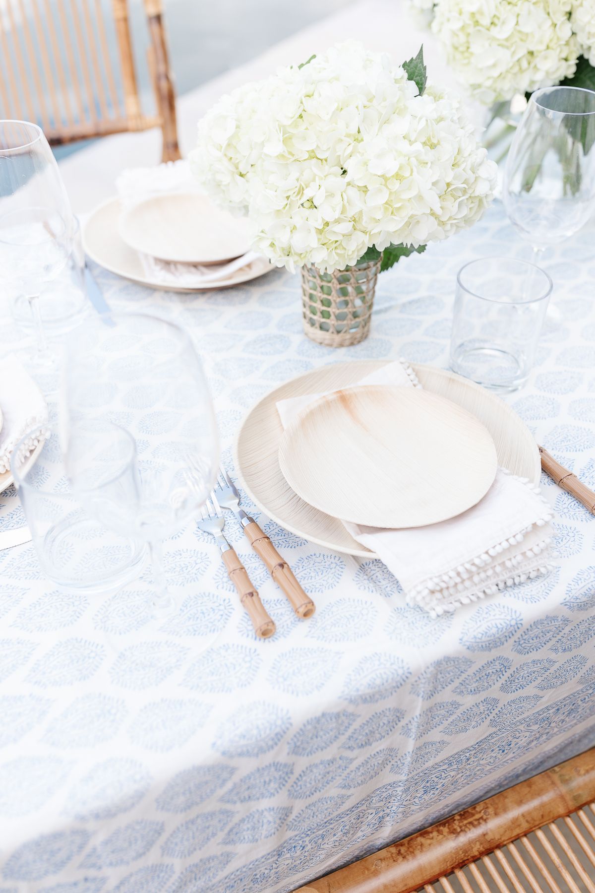 Mother's day brunch ideas with a table set with a blue and white tablecloth and bamboo accents