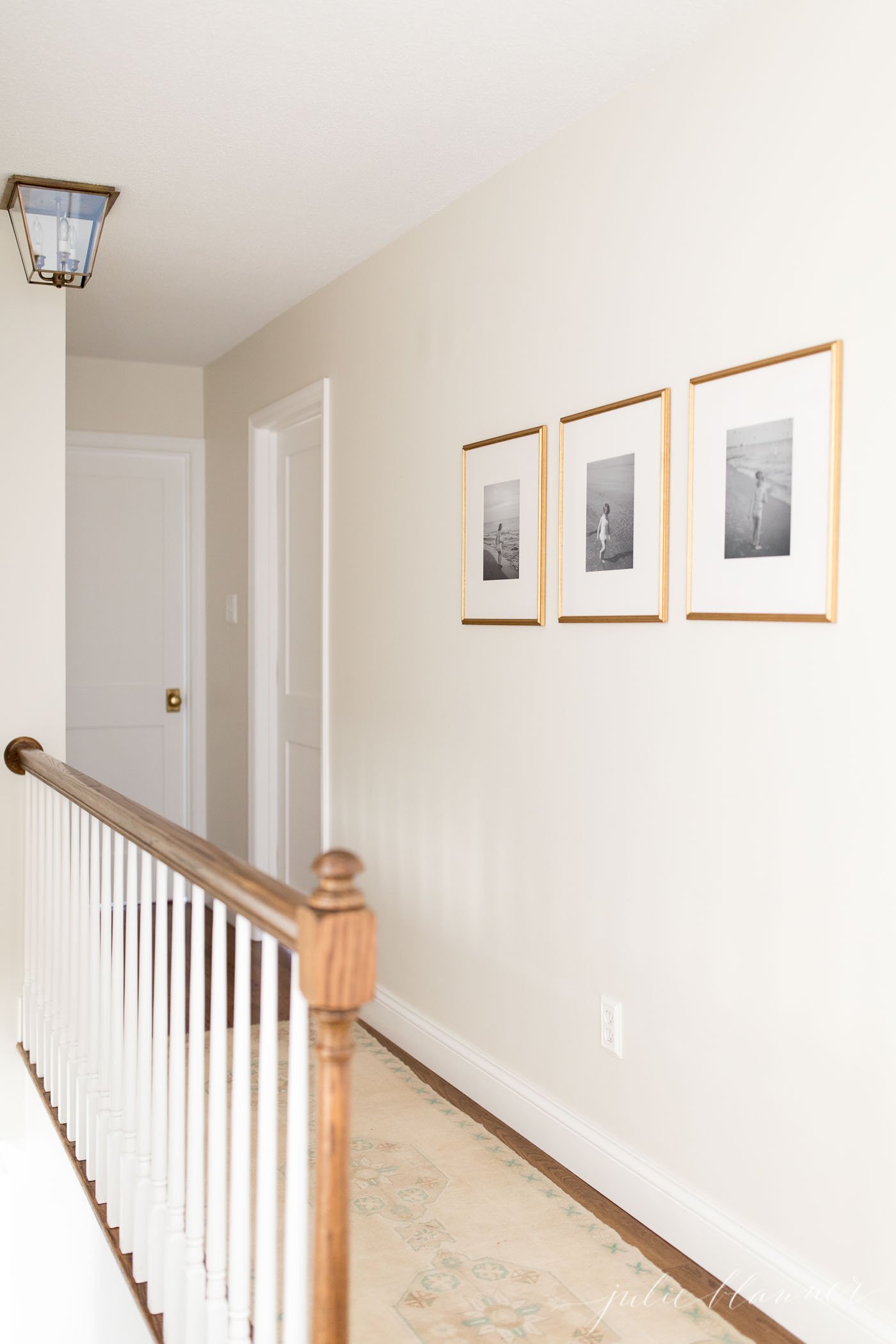 white trim paint in a white hallway of bedroom and bathroom doors.