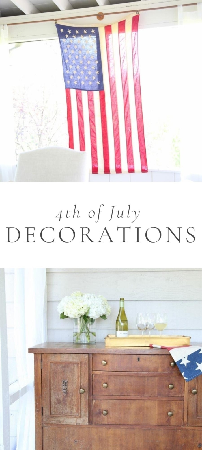 hanging American flag and desk with white flowers and bottles