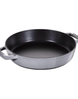 a gray Staub cast iron skillet with two handles