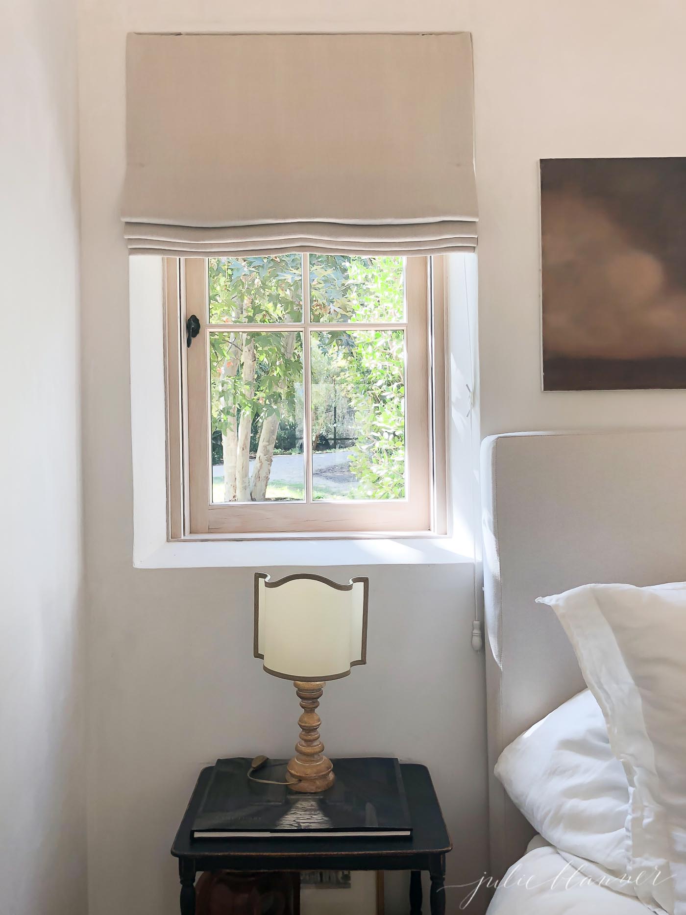 linen roman shade in bedroom vignette featuring country decor.