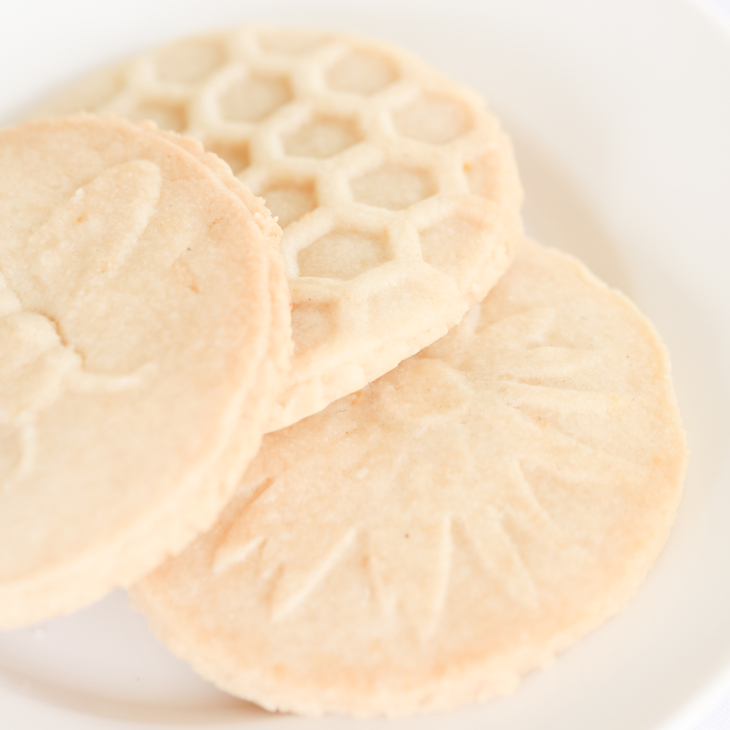 honeycomb stamped lemon shortbread cookies on white plate