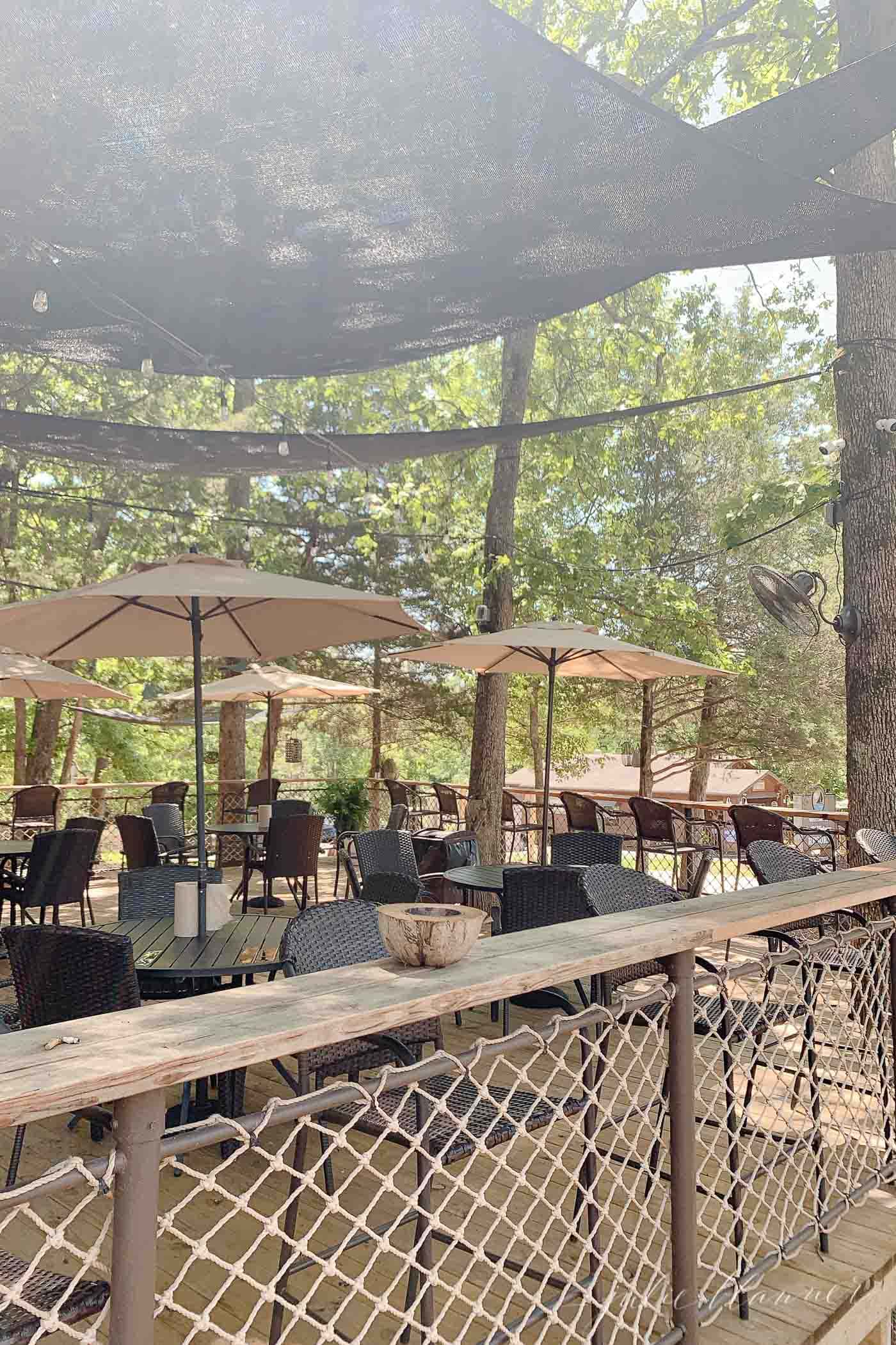 outdoor dining area with umbrellas at stillwater resort