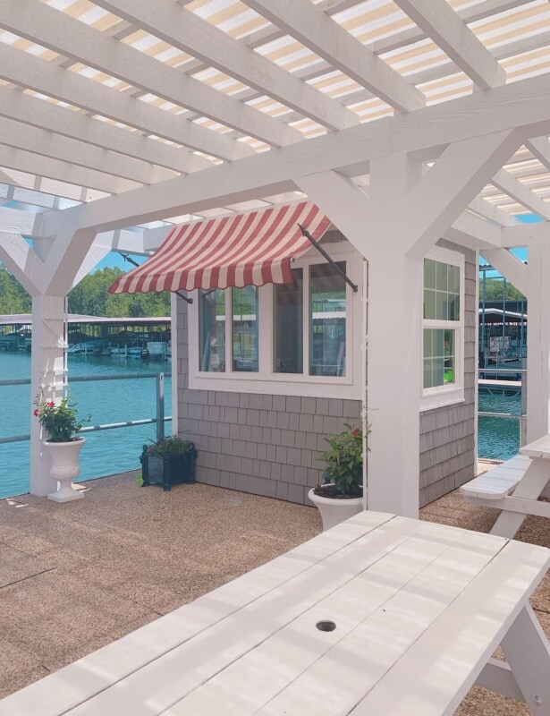 state park marina snow cone shop with stripe awning and pergola