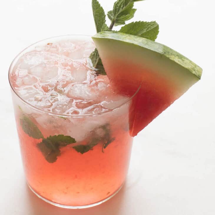 watermelon mojito garnished with mint and a watermelon slice
