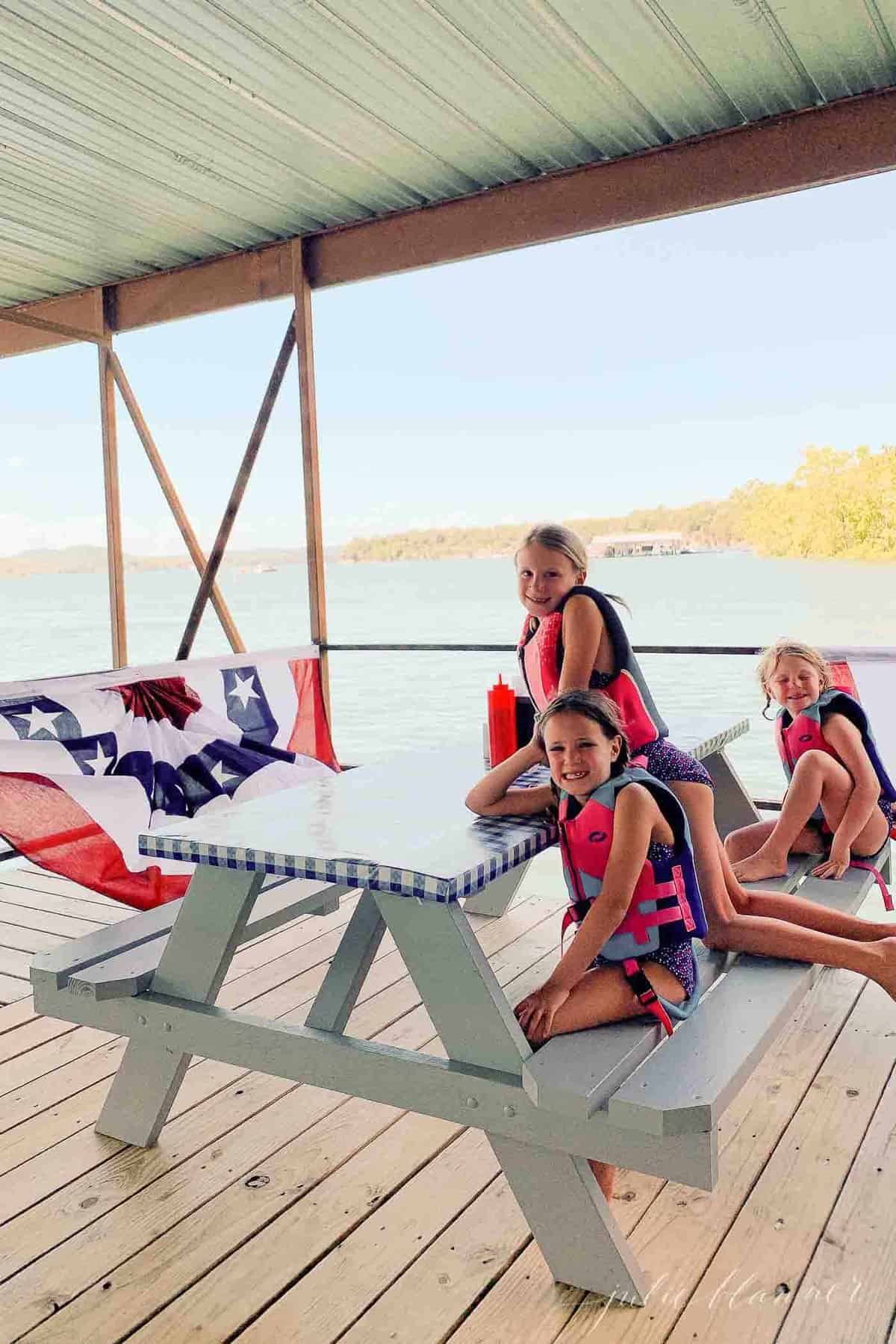 kids at a picnic table on dock at restaurant on table rock lake