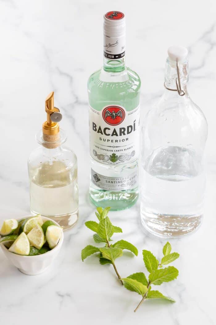 ingredients to make mojitos on marble surface