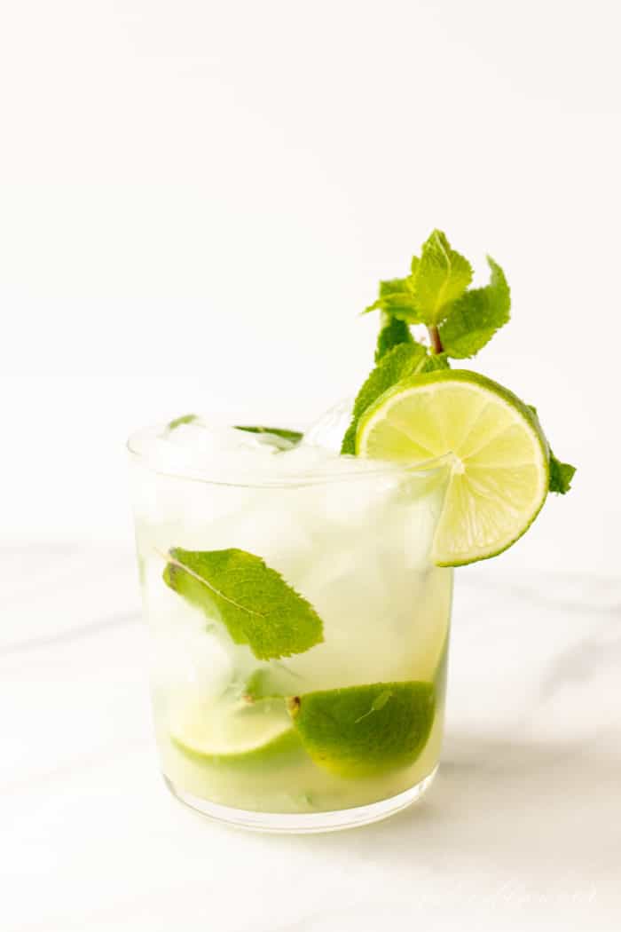 skinny mojito in a short glass with lime and fresh mint