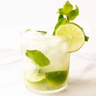 skinny mojito in a short glass with lime and fresh mint