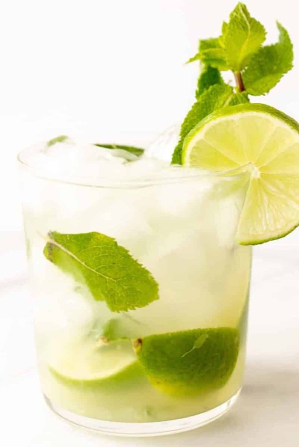 skinny mojito in a short glass with lime and fresh mint