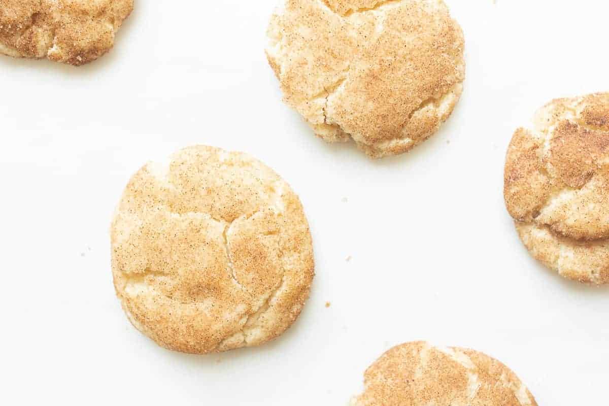 Snickerdoodle cookies on a white surface. 