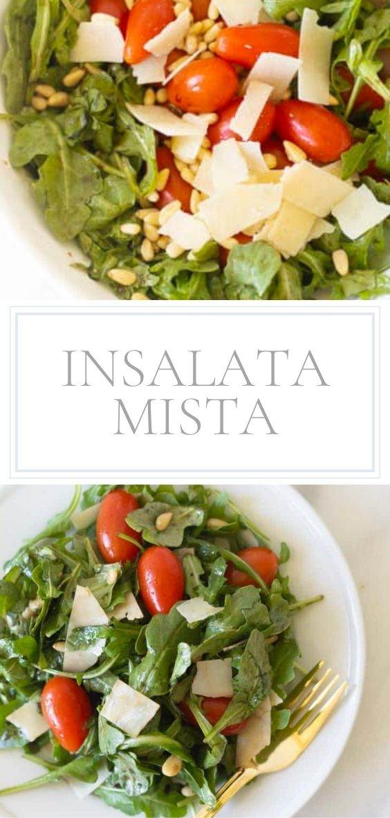 White salad bowl and wooden spoons, filled with insalata mista.