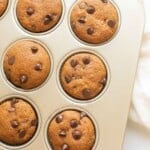 pumpkin chocolate chip muffins in a muffin tin