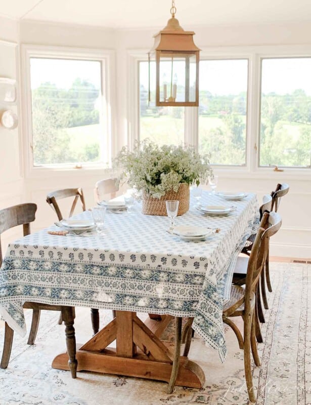 kalamkari table setting in neutral room with brass lantern