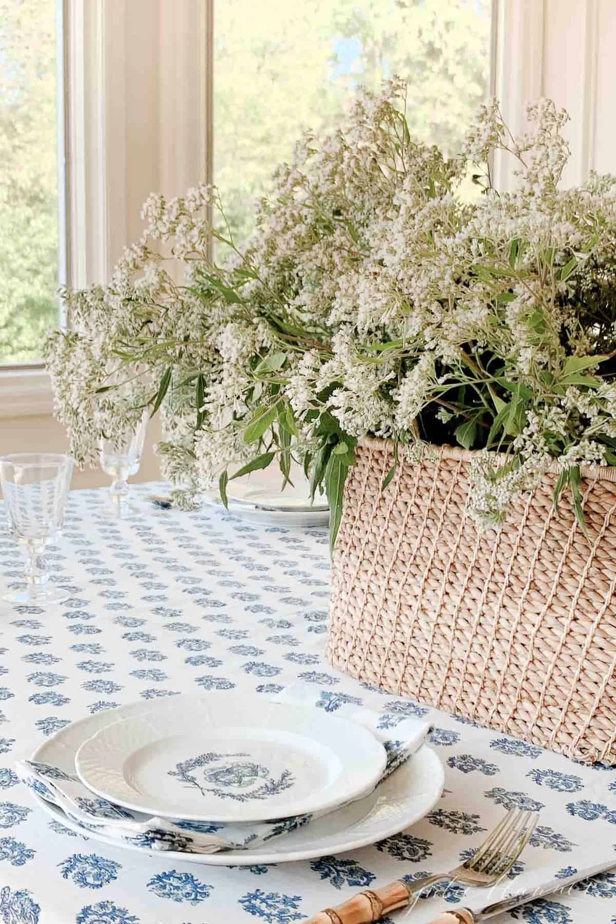 wildflowers in a basket on a kalamakari block print table cloth