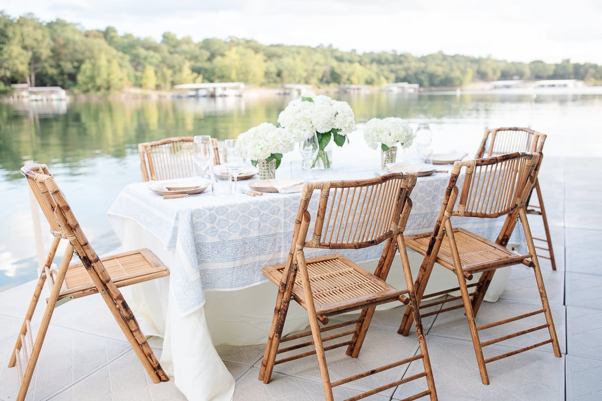 A table set with a white block print tablecloth.