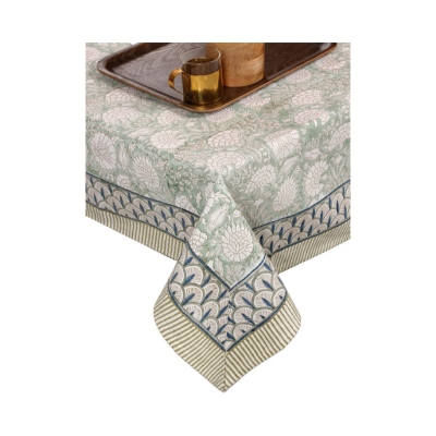 A green and white block print tablecloth.