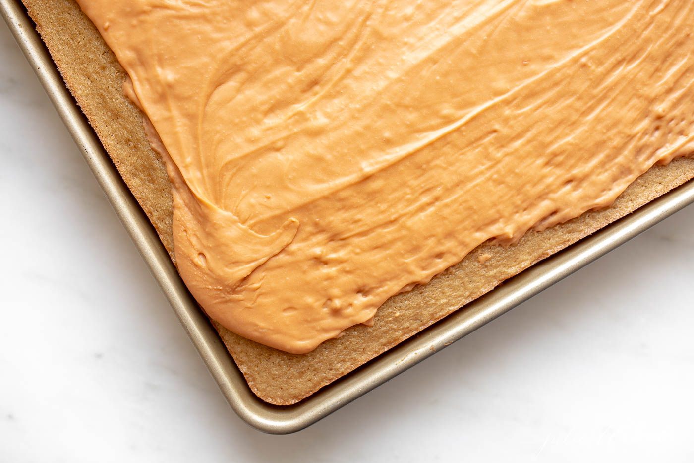 A butterscotch cake in a half sheet pan.