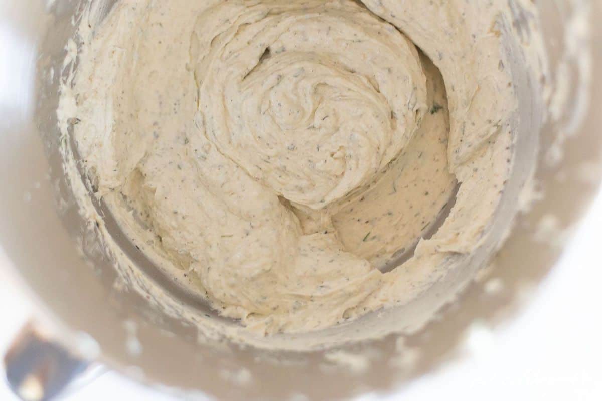 looking into a kitchenaid mixer with herb cream cheese spread. #boursincheese #homemadeboursin