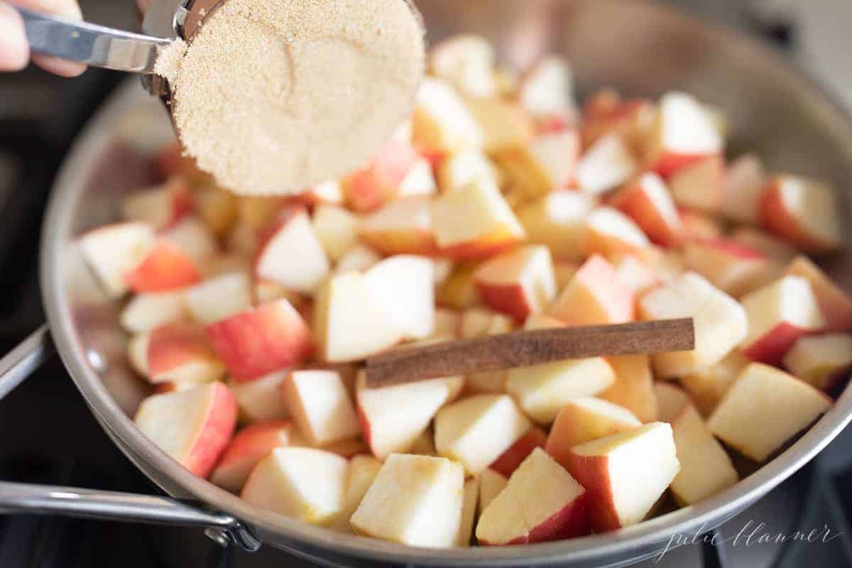 brown sugar and cinnamon stick added to apples