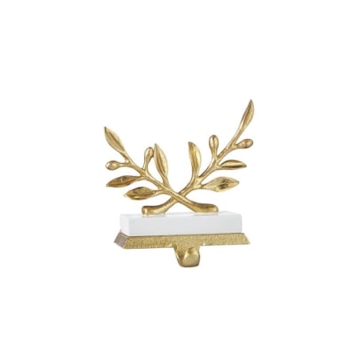 A gold leaf-shaped laurel wreath holder on a white background.