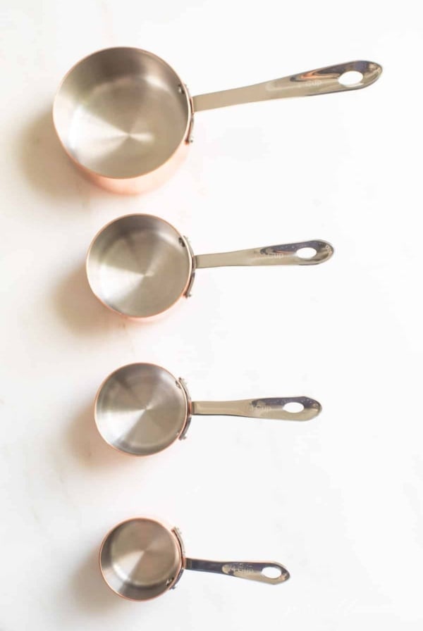 measuring cups on a marble surface