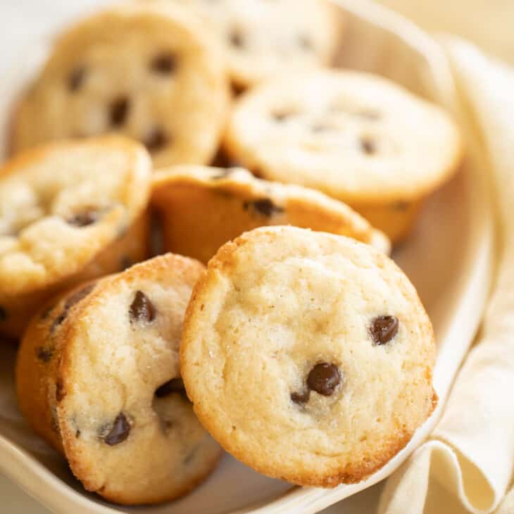 Chocolate chip muffins on a white serving plate