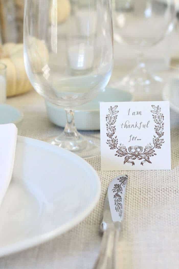 I'm thankful for card on a Thanksgiving table.
