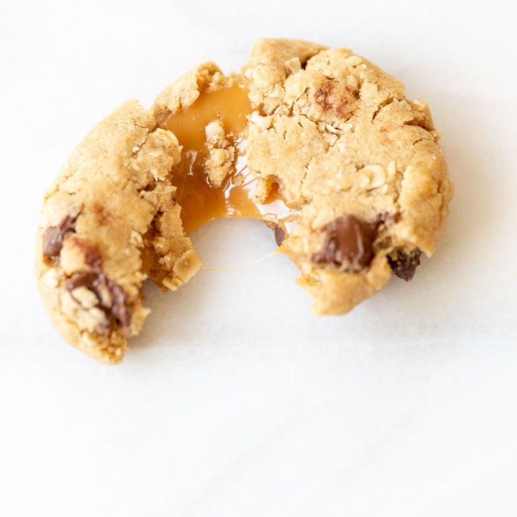 A carmelita cookie on a white marble surface.