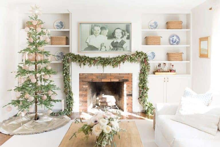 A white living room decorated for the holidays with easy Christmas decorations.