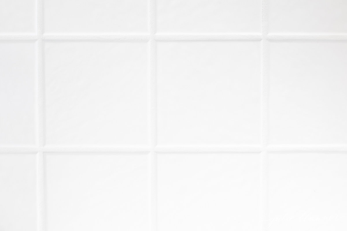 White tile with the grout lines refreshed with Polyblend Grout Renew.
