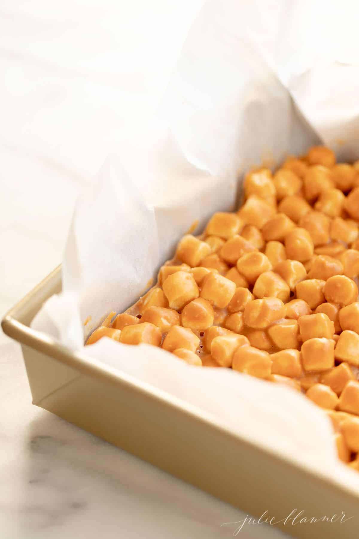 Close-up of a pan of butterscotch dessert, marshmallows at the top.