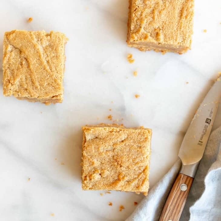 peanut butter brownie squares by a knife