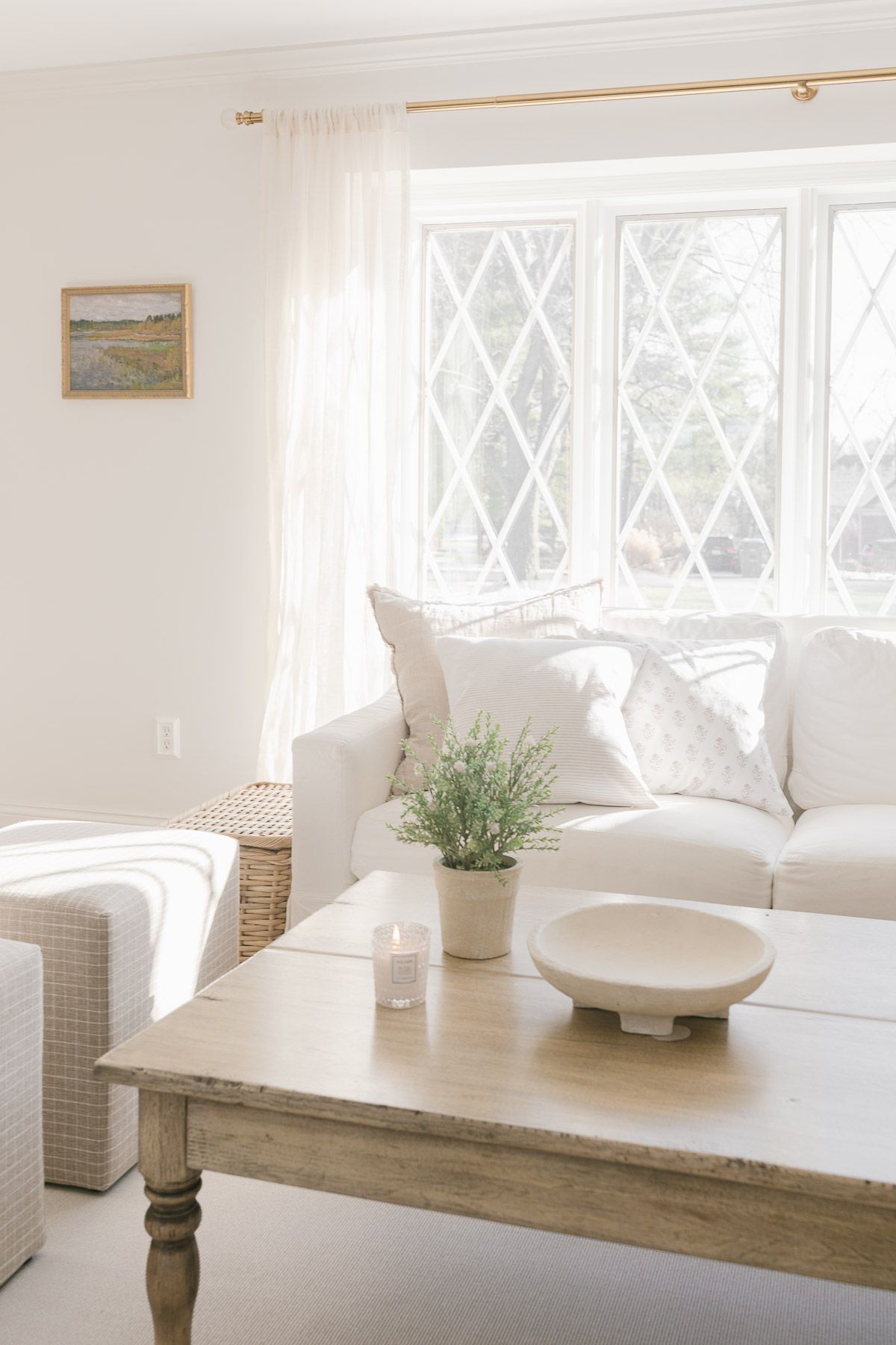 A white living room with a white Pottery Barn sofa