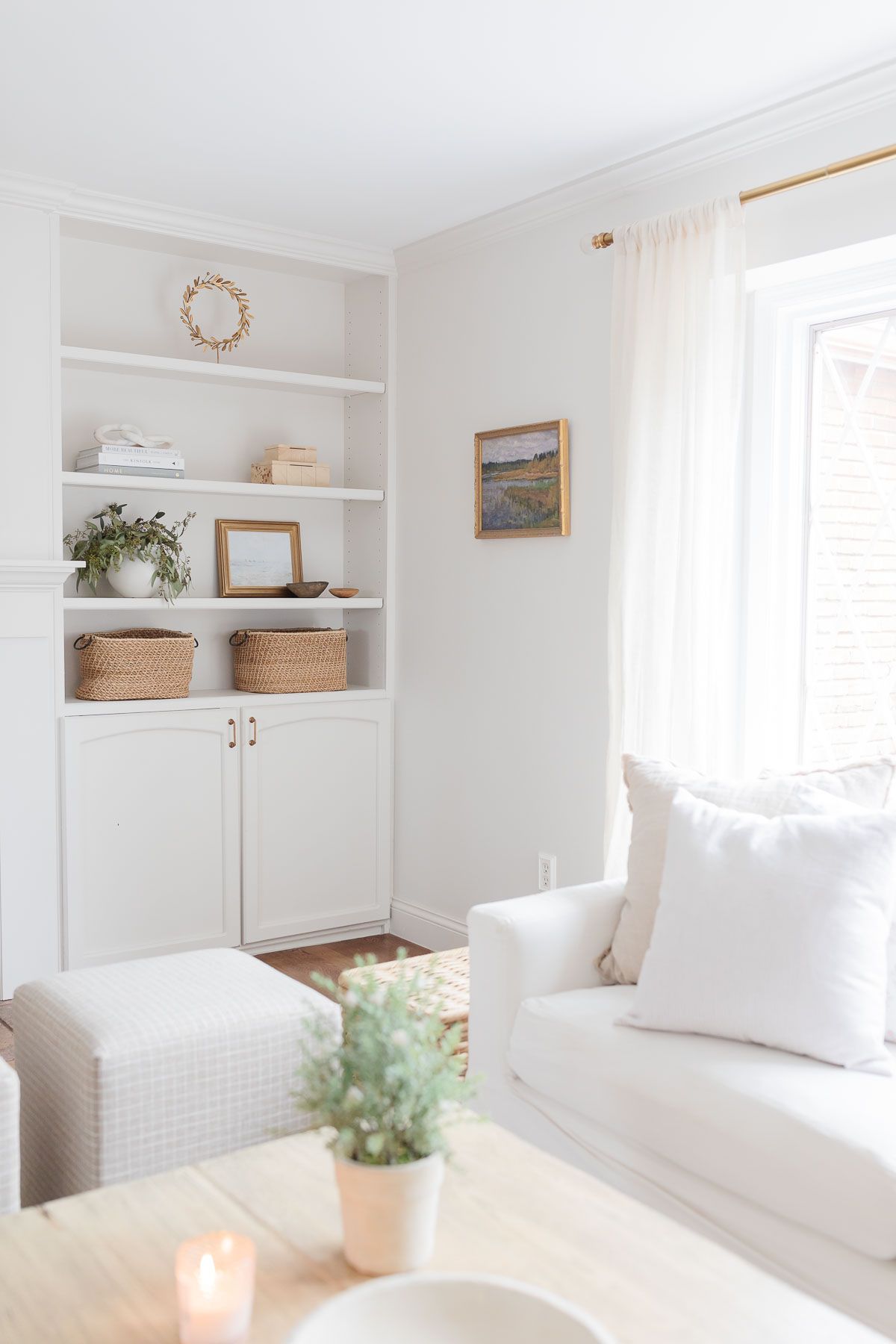 A white living room with a white Pottery Barn sofa
